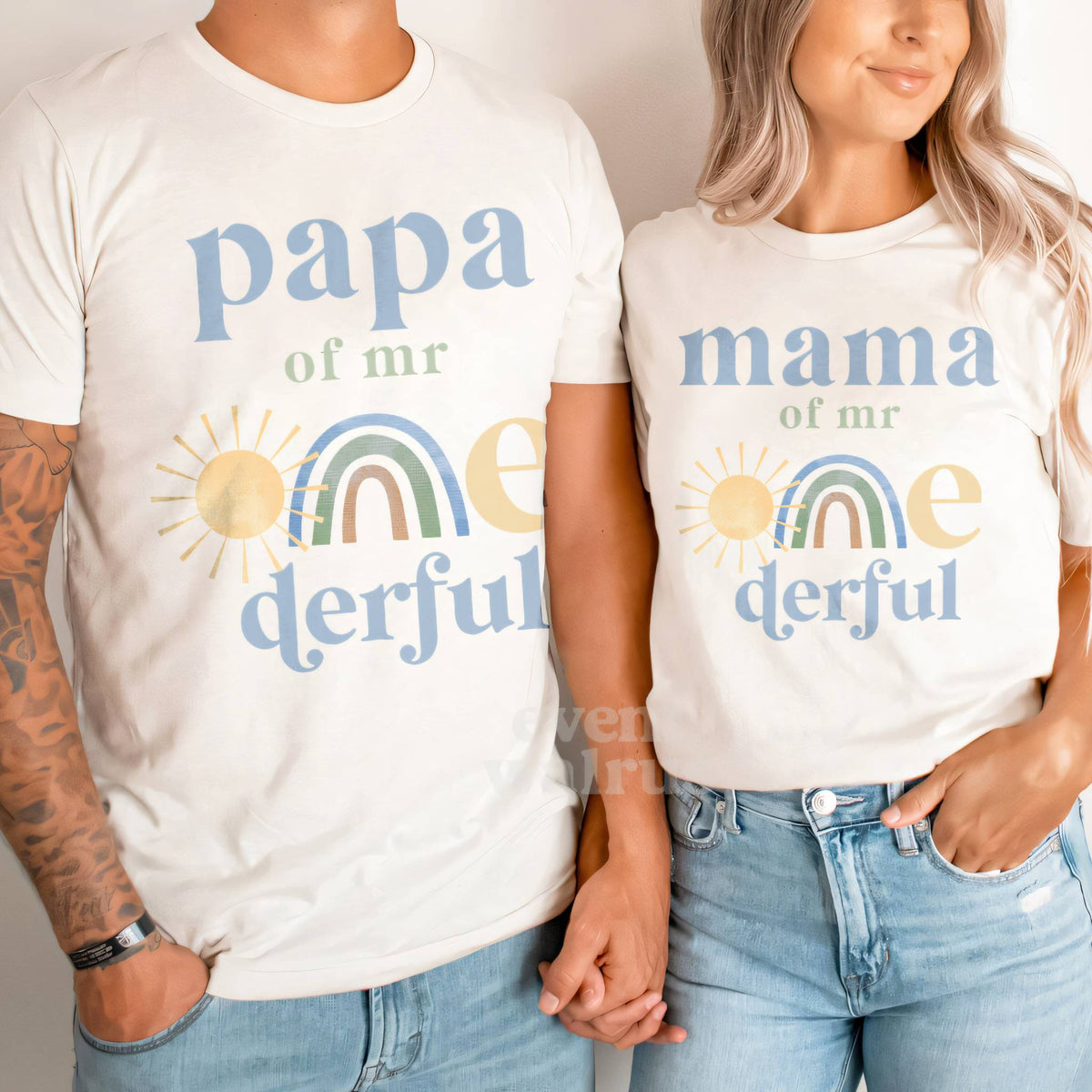 Dad and Mom in white Papa and Mama of Mr Onederful shirts with a pastel rainbow and sun