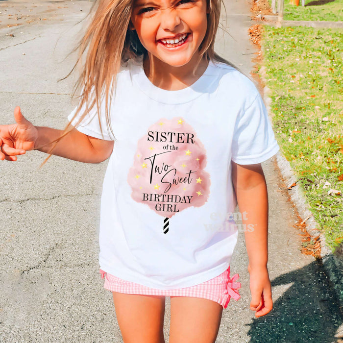 Laughing girl outdoors in a white Sister of the Two Sweet cotton candy shirt.