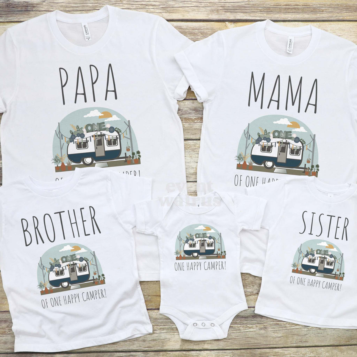 Papa, Mama, Brother, Sister and baby One Happy Camper shirts with a vintage camper laid out on wood