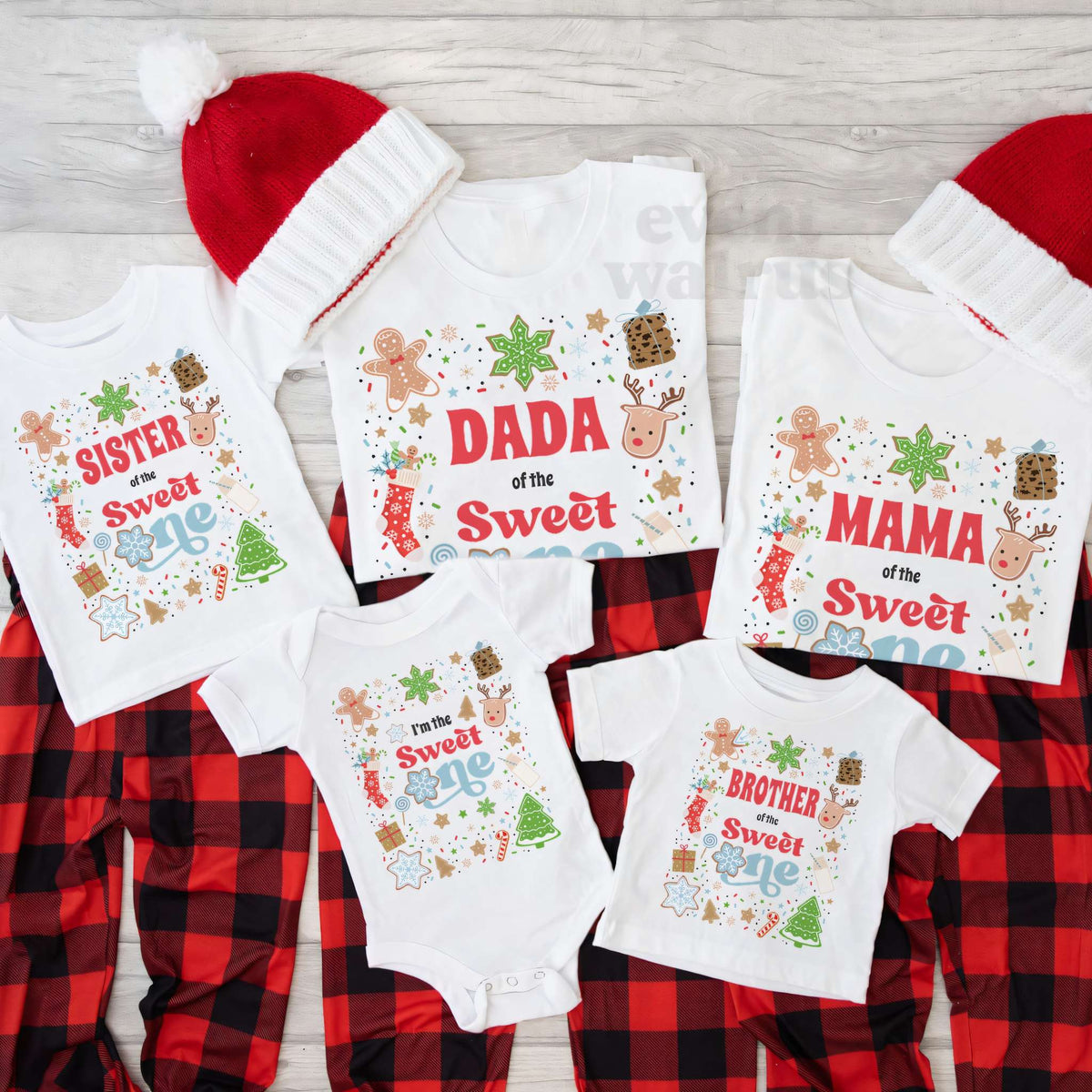 Sweet One Christmas cookie family shirts and a baby bodysuit on red plaid with Santa hats
