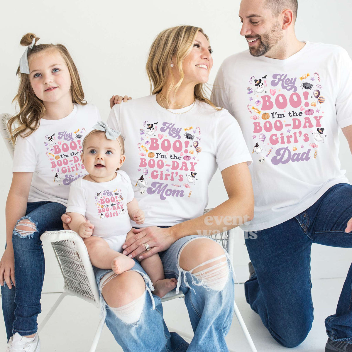 Mom, Dad, big sister and baby in matching white Hey Boo Boo-Day shirts in pink and purple