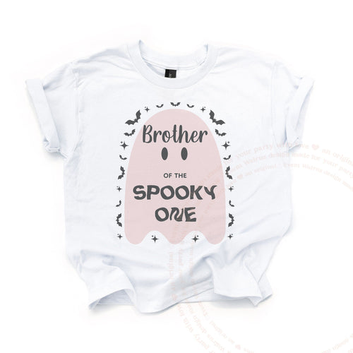 White Brother of the Spooky One kids tee laid flat, with the big blush ghost and tiny bats.