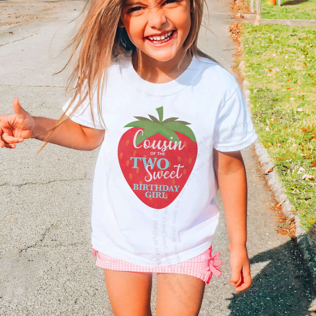 Laughing girl outdoors in a white Cousin of the Two Sweet kids tee.