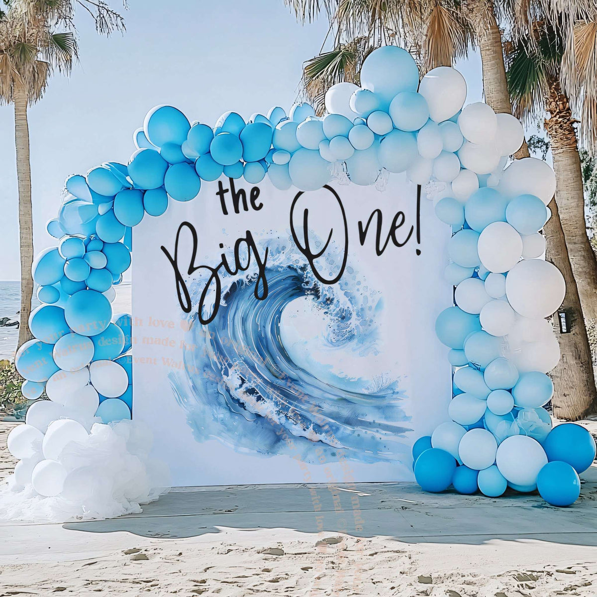 Blue wave backdrop under palm trees with a light blue and white balloon garland.