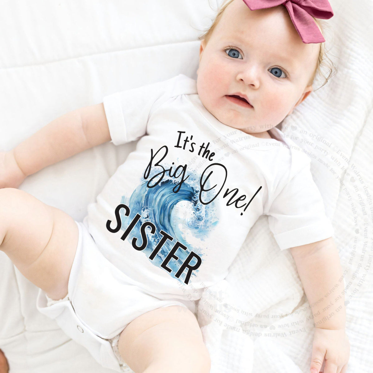 Baby girl with a pink bow in a white It's the Big One Sister bodysuit.