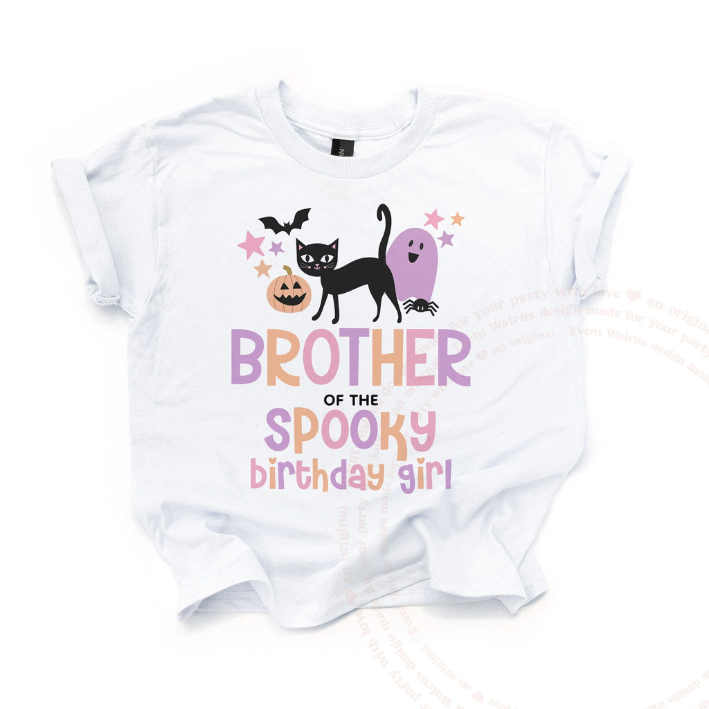White Brother of the Spooky Birthday Girl kids tee laid flat, with the black cat, pumpkin and purple ghost.