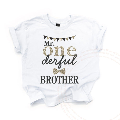 White Mr Onederful Brother kids tee laid flat, with gold glitter ONE, a banner and a bow tie.