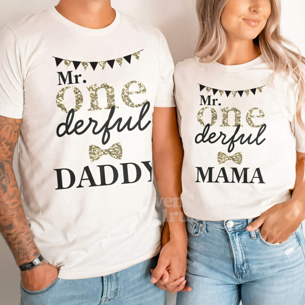 Dad and Mom holding hands in white Daddy and Mama Mr Onederful shirts.