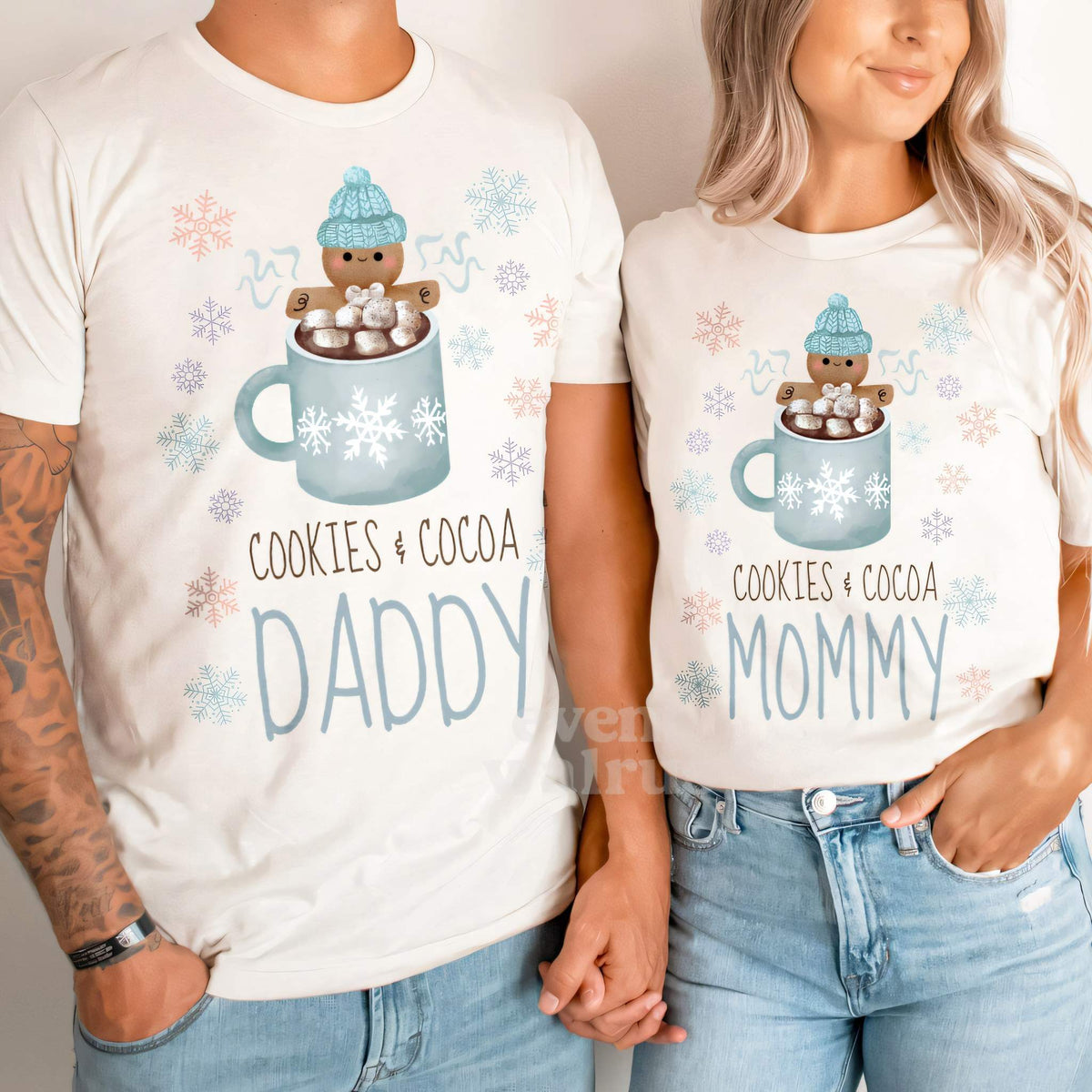 Dad and Mom holding hands in white Daddy and Mommy Cookies and Cocoa shirts.