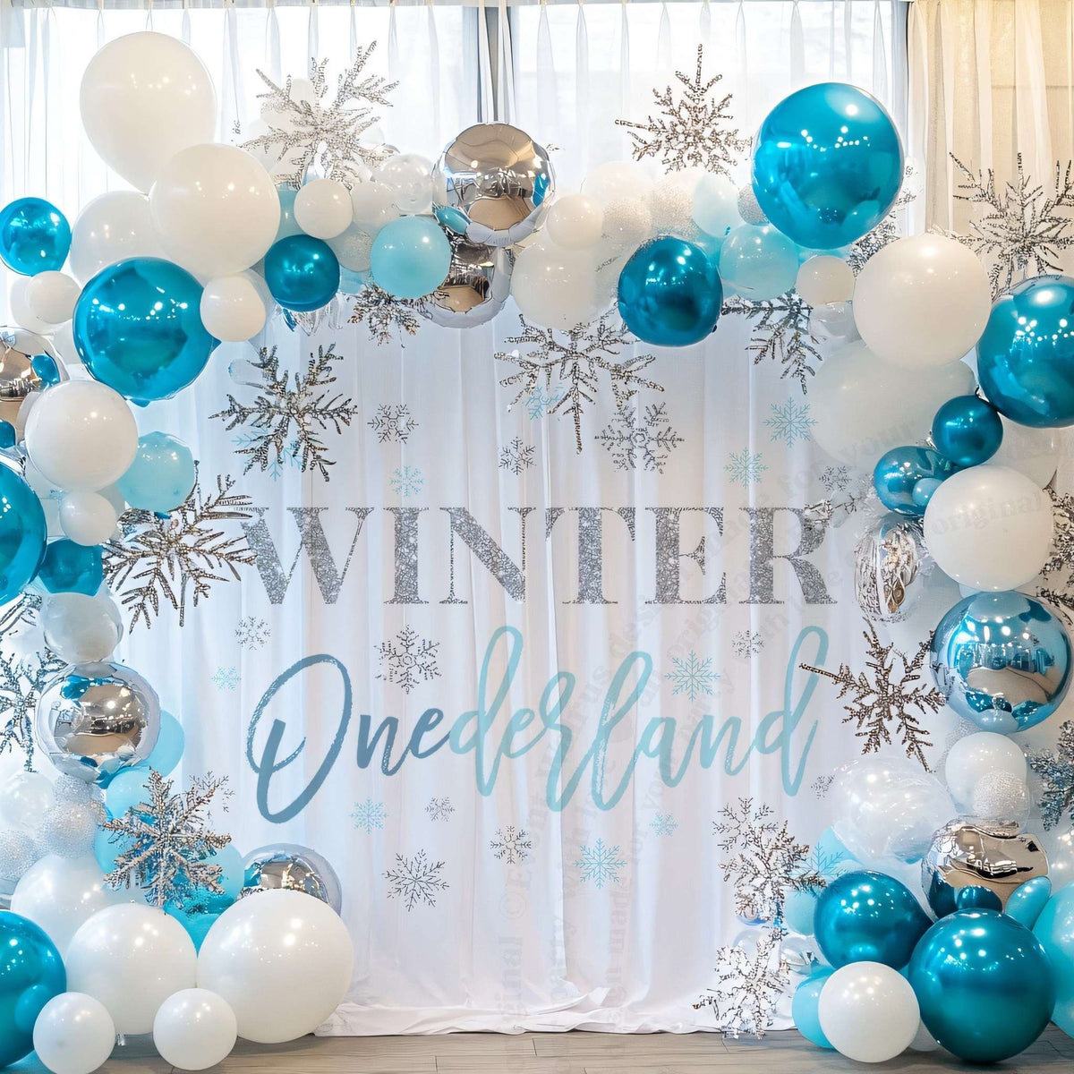 Silver glitter WINTER backdrop framed by teal, white and silver balloons and glittery snowflakes.