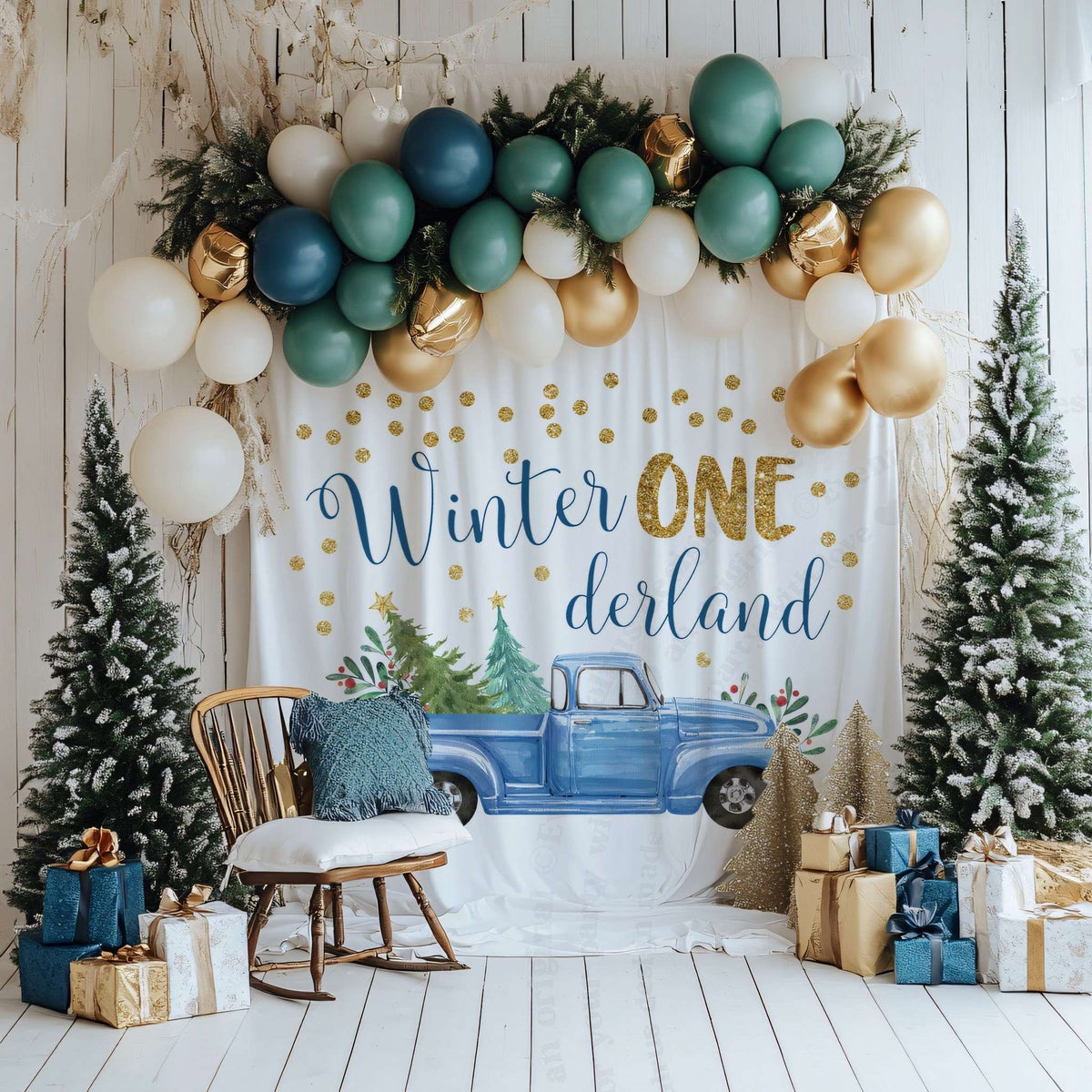 Blue pickup backdrop with flocked trees, a rocking chair and wrapped gifts in a white room.