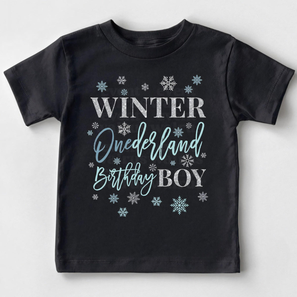 Black Winter Onederland Birthday Boy toddler tee with blue script and silver snowflakes.