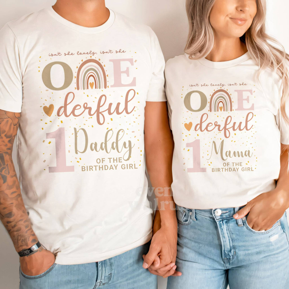 Dad and Mom holding hands in white Daddy and Mama boho rainbow Onederful shirts.