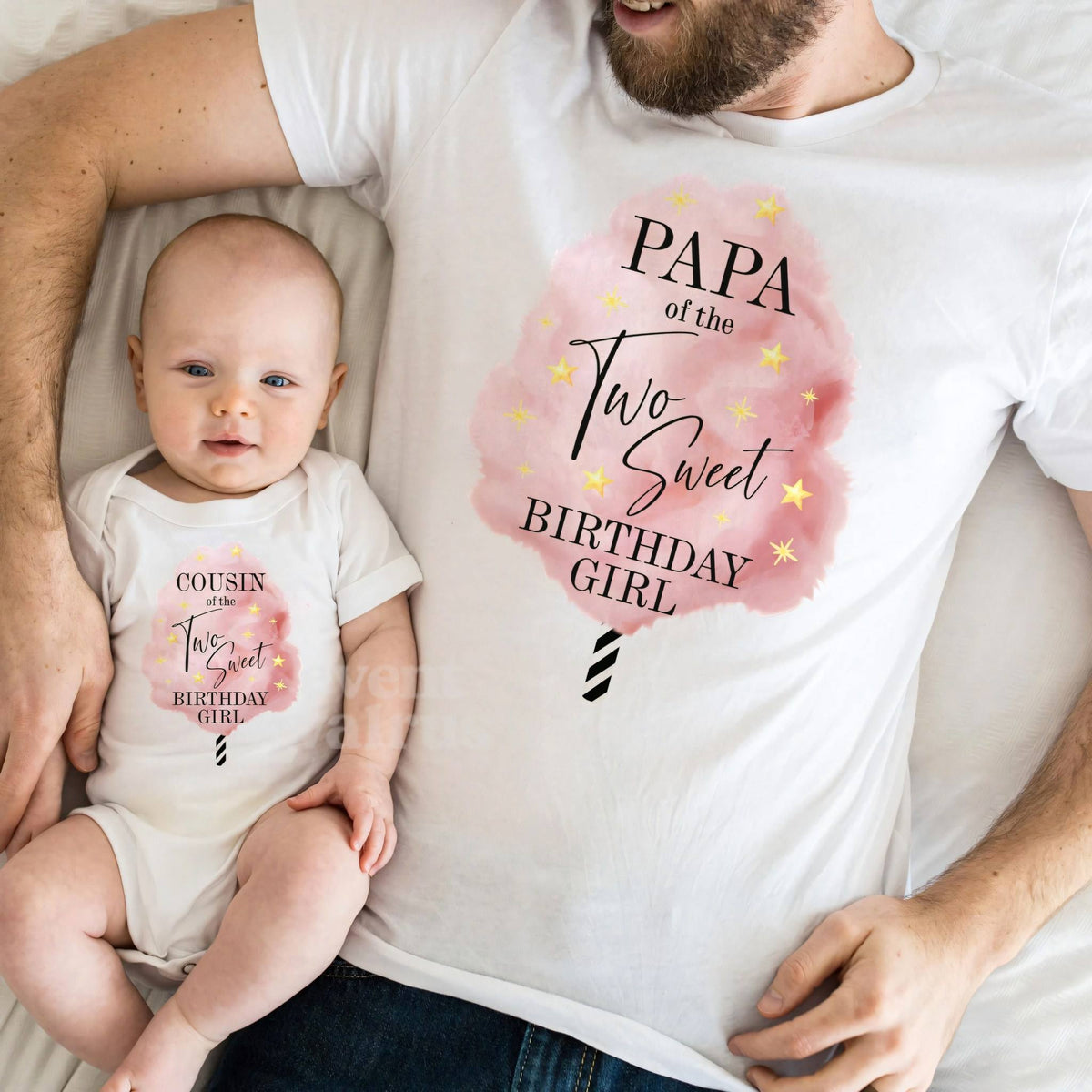 Baby in a Cousin of the Two Sweet bodysuit lying on Dad in his Papa shirt.
