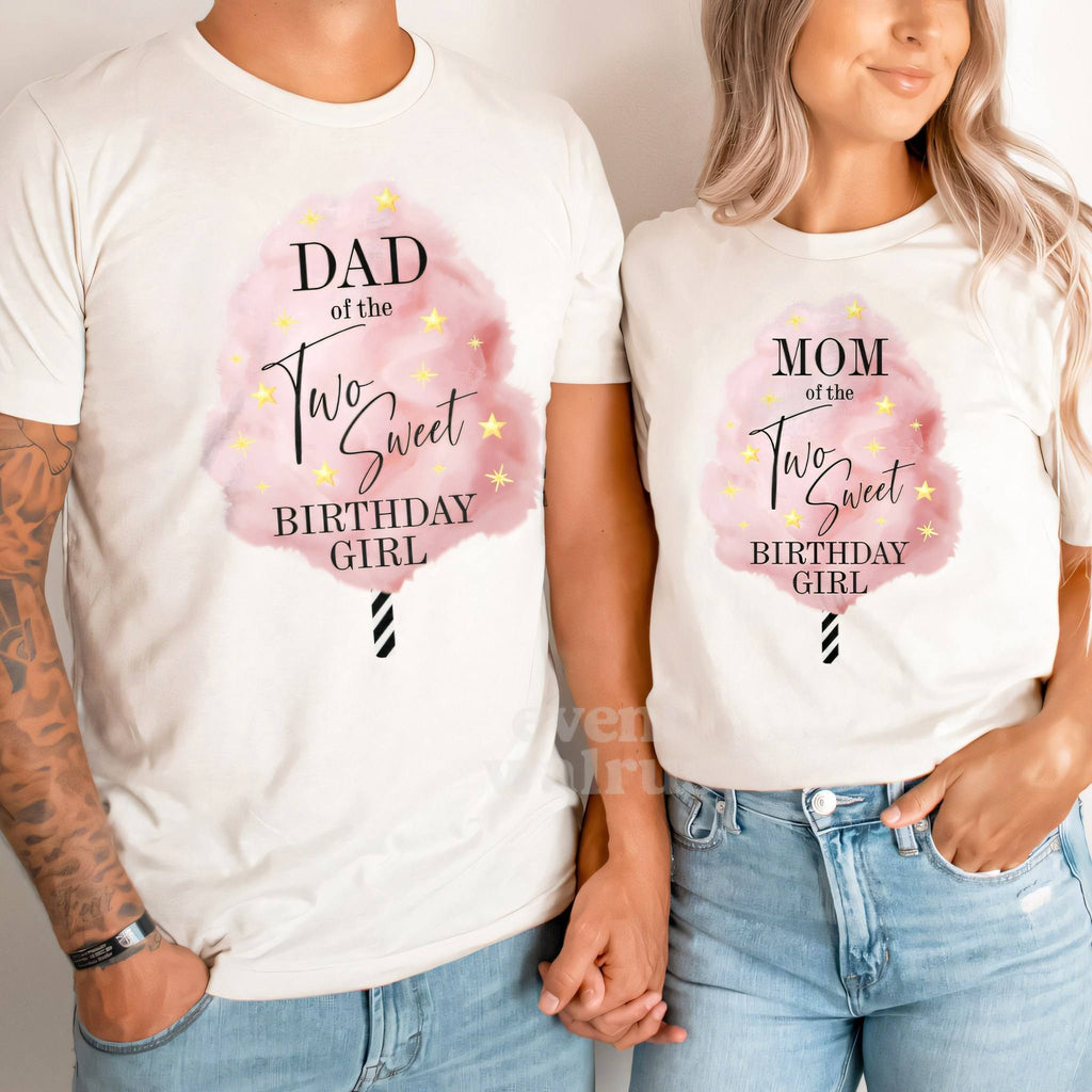 Dad and Mom holding hands in white Dad and Mom cotton candy Two Sweet shirts.