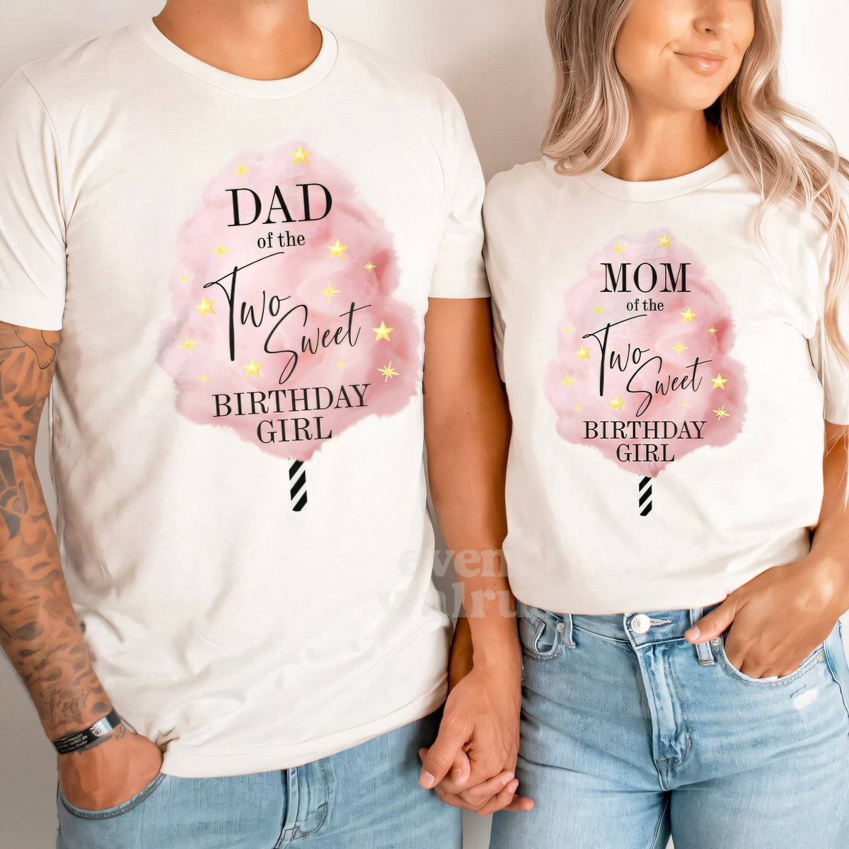 Dad and Mom holding hands in white Dad and Mom cotton candy Two Sweet shirts.