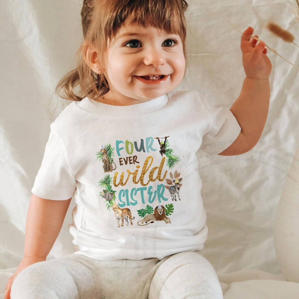 Smiling baby girl in a white Four Ever Wild Sister baby tee.