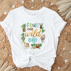 White Four Ever Wild Dad tee knotted on a jute rug with dried palm leaves.