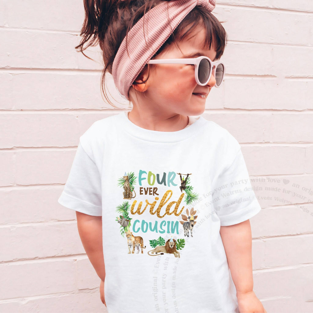 Girl in a pink headband and sunglasses wearing a white Four Ever Wild Cousin tee.