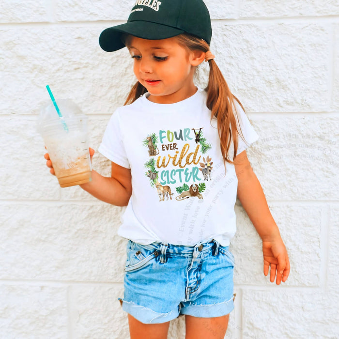 Girl in a black cap holding a drink in a white Four Ever Wild Sister tee.