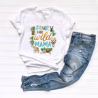 White Four Ever Wild Mama tee with jungle animals laid flat beside jeans.
