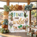 Four ever wild backdrop in a sunny room with giraffes outside and a sage and gold balloon column.