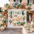 Safari 4th birthday backdrop on a stone patio under string lights with a neutral balloon arch.