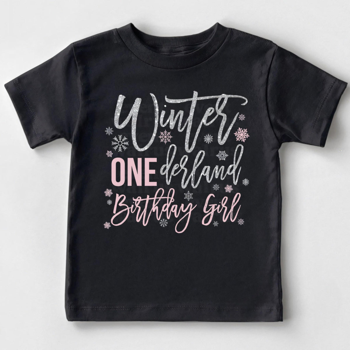 Black Winter ONEderland Birthday Girl toddler tee laid flat.
