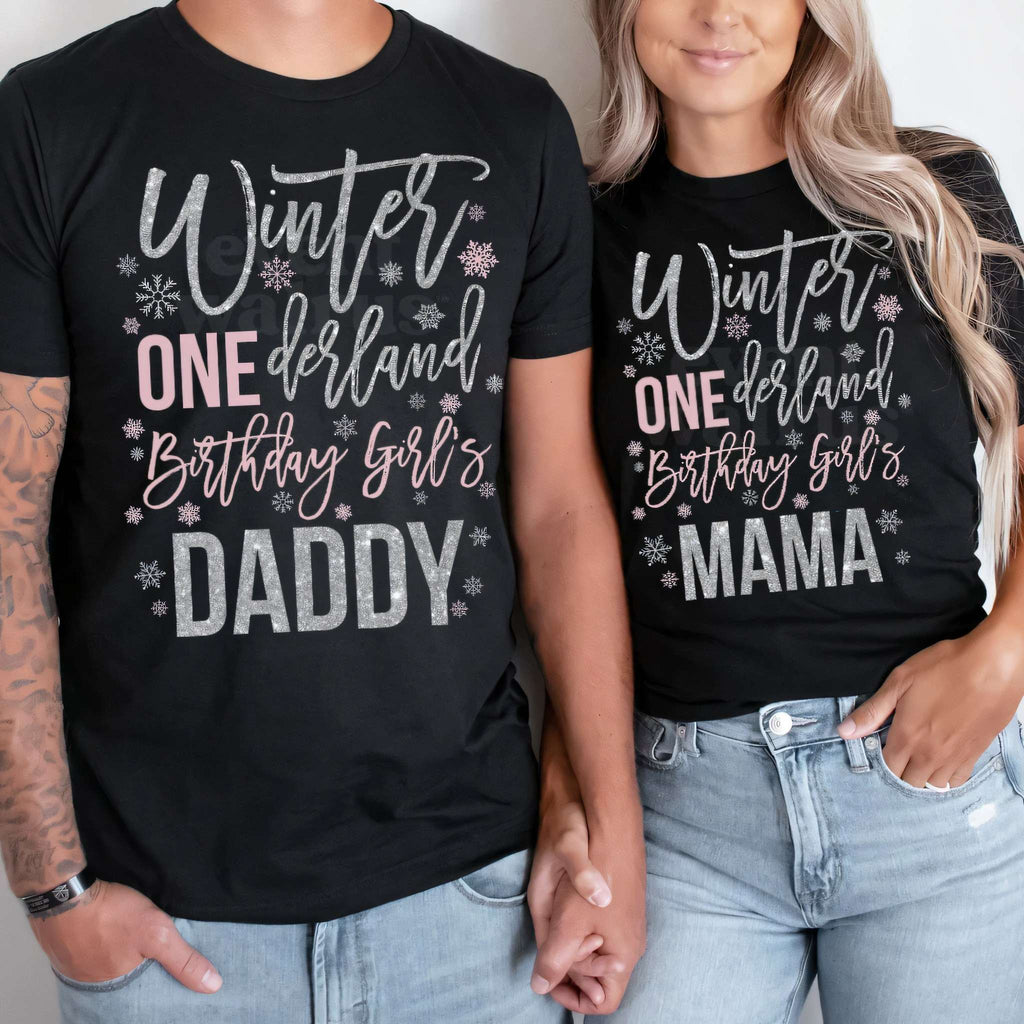 Dad and Mom in black Daddy and Mama Winter ONEderland shirts with silver glitter lettering.