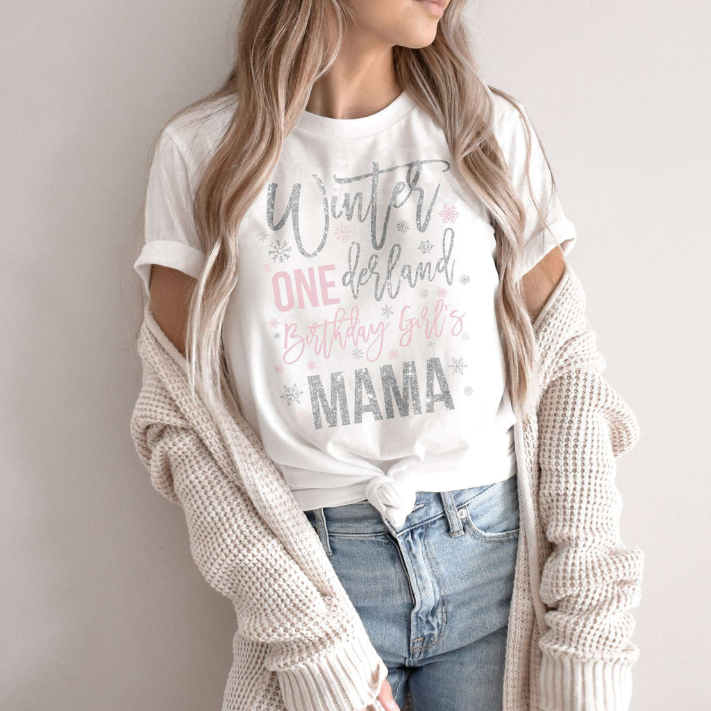 Woman in a knit cardigan wearing a white Winter ONEderland Birthday Girl's Mama shirt.