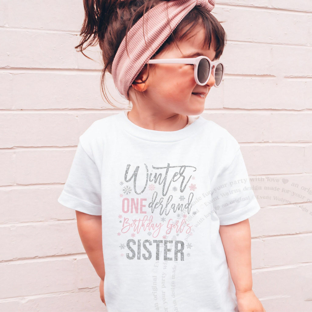 Girl in sunglasses and a pink headband wearing a white Winter ONEderland Birthday Girl's Sister shirt.