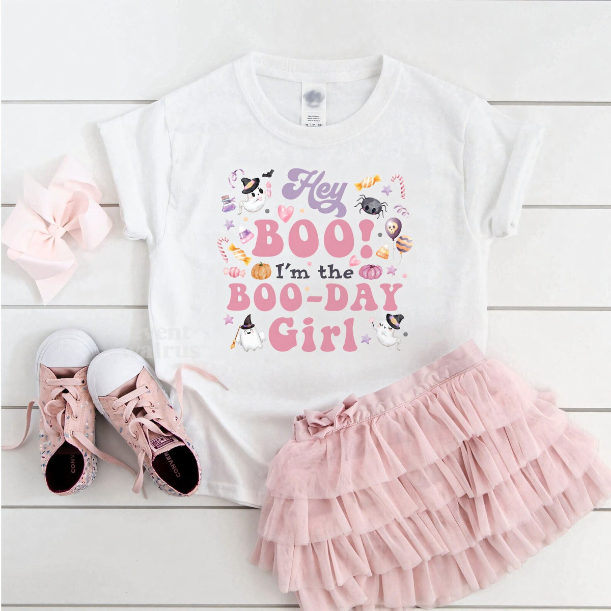 White Hey Boo Boo-Day Girl toddler tee laid flat with a pink tutu and sneakers.