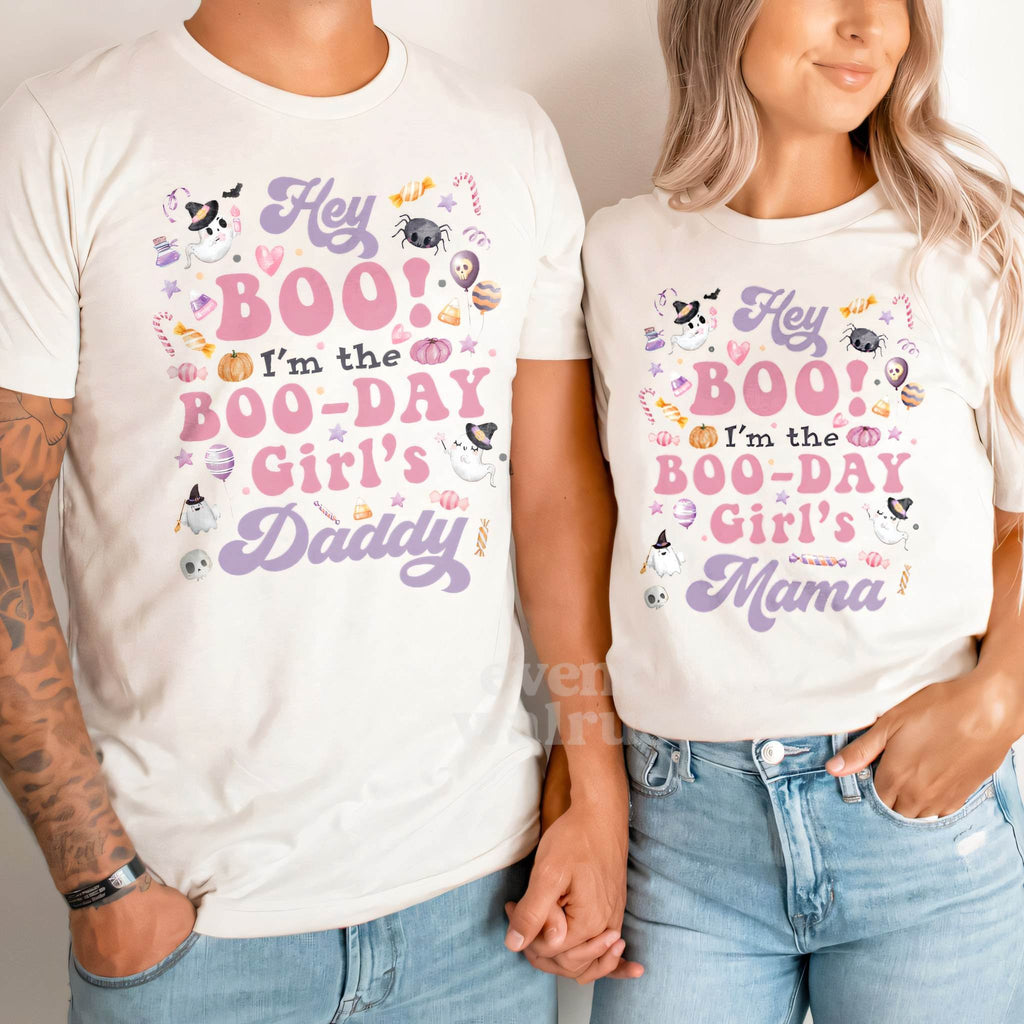 Dad and Mom holding hands in white Daddy and Mama Hey Boo shirts.