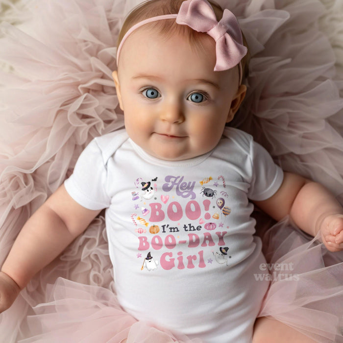 Baby girl with a pink bow on tulle in a white Hey Boo I'm the Boo-Day Girl bodysuit.