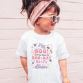 Girl in sunglasses and a pink headband wearing a white Hey Boo Boo-Day Girl's Sister shirt.