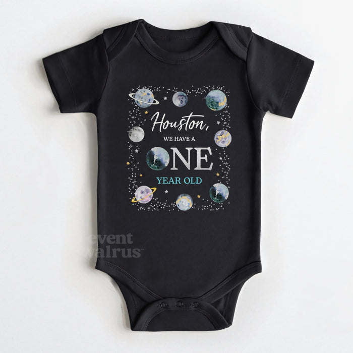 Black baby bodysuit reading Houston We Have a ONE Year Old with watercolor planets.