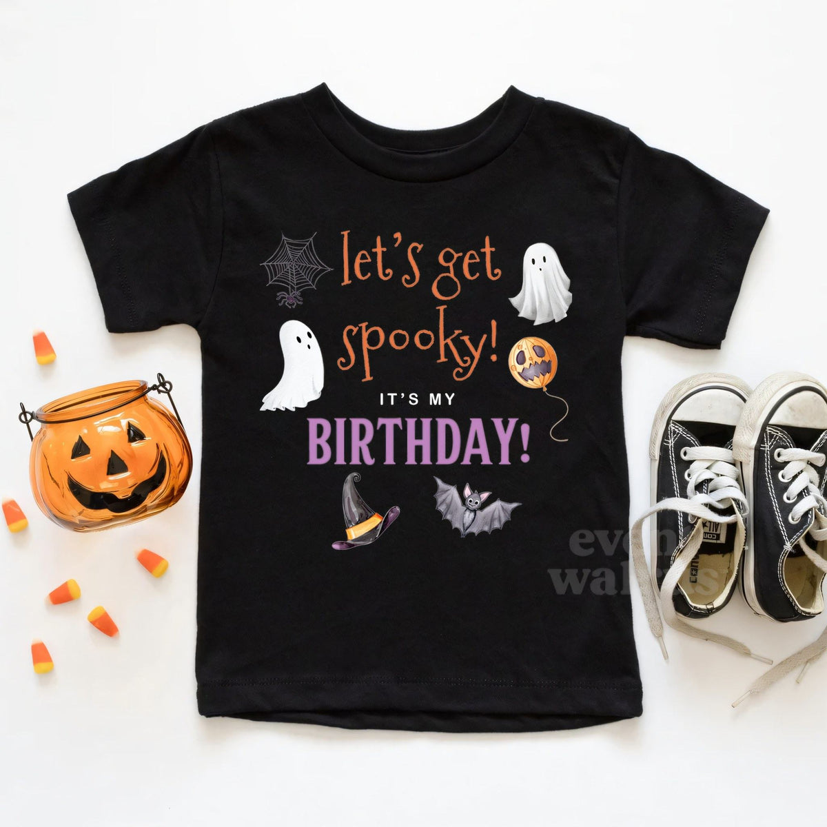 Black toddler It's My Birthday Let's Get Spooky tee beside a jack-o-lantern pail.