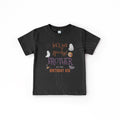Toddler boy with a pacifier in a black Let's Get Spooky Brother of the Birthday Kid shirt.