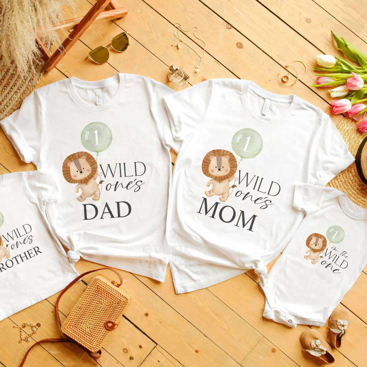 Brother kids tee laid out with the Dad, Mom and baby lion Wild One shirts.
