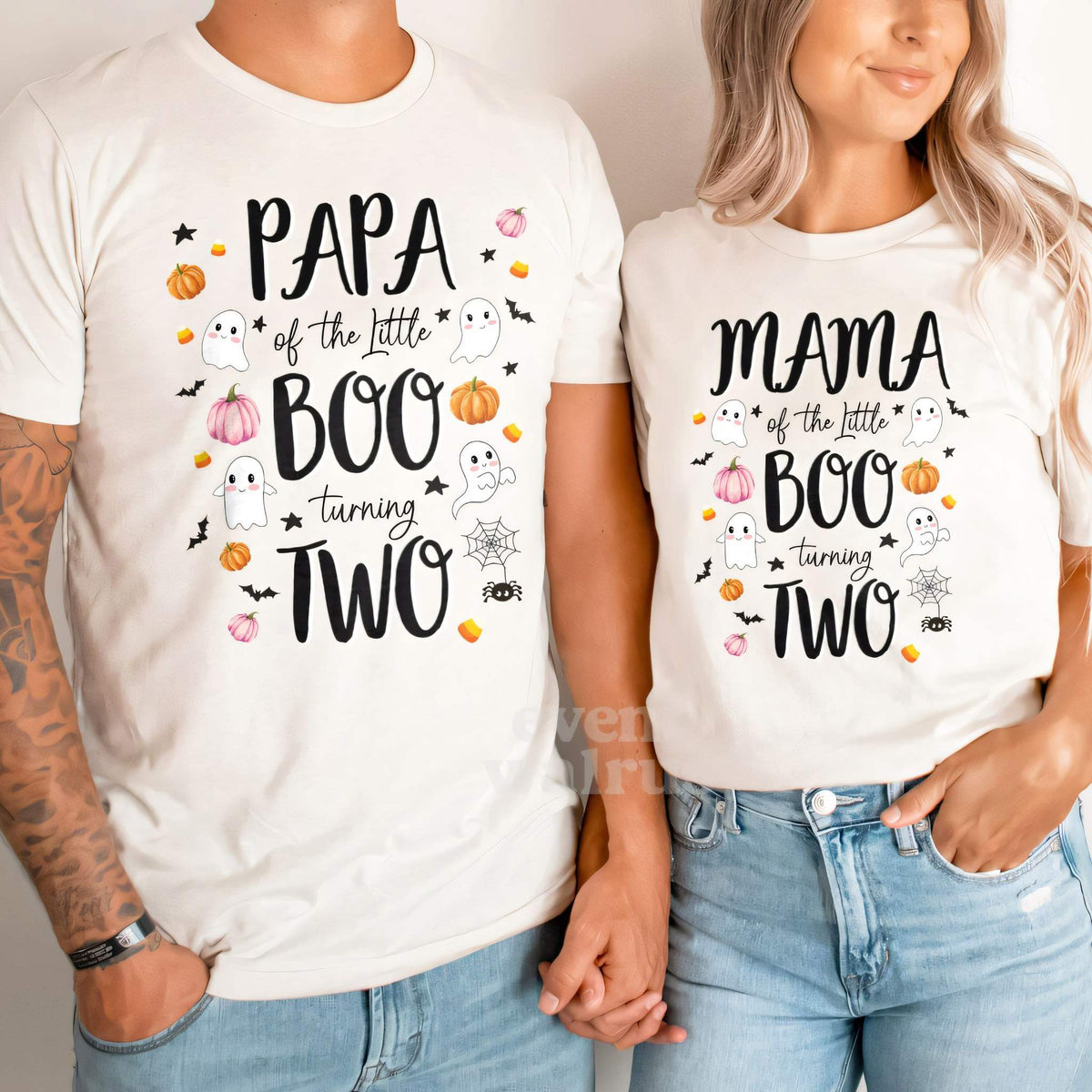 Dad and Mom holding hands in white Papa and Mama Little Boo Turning Two shirts.