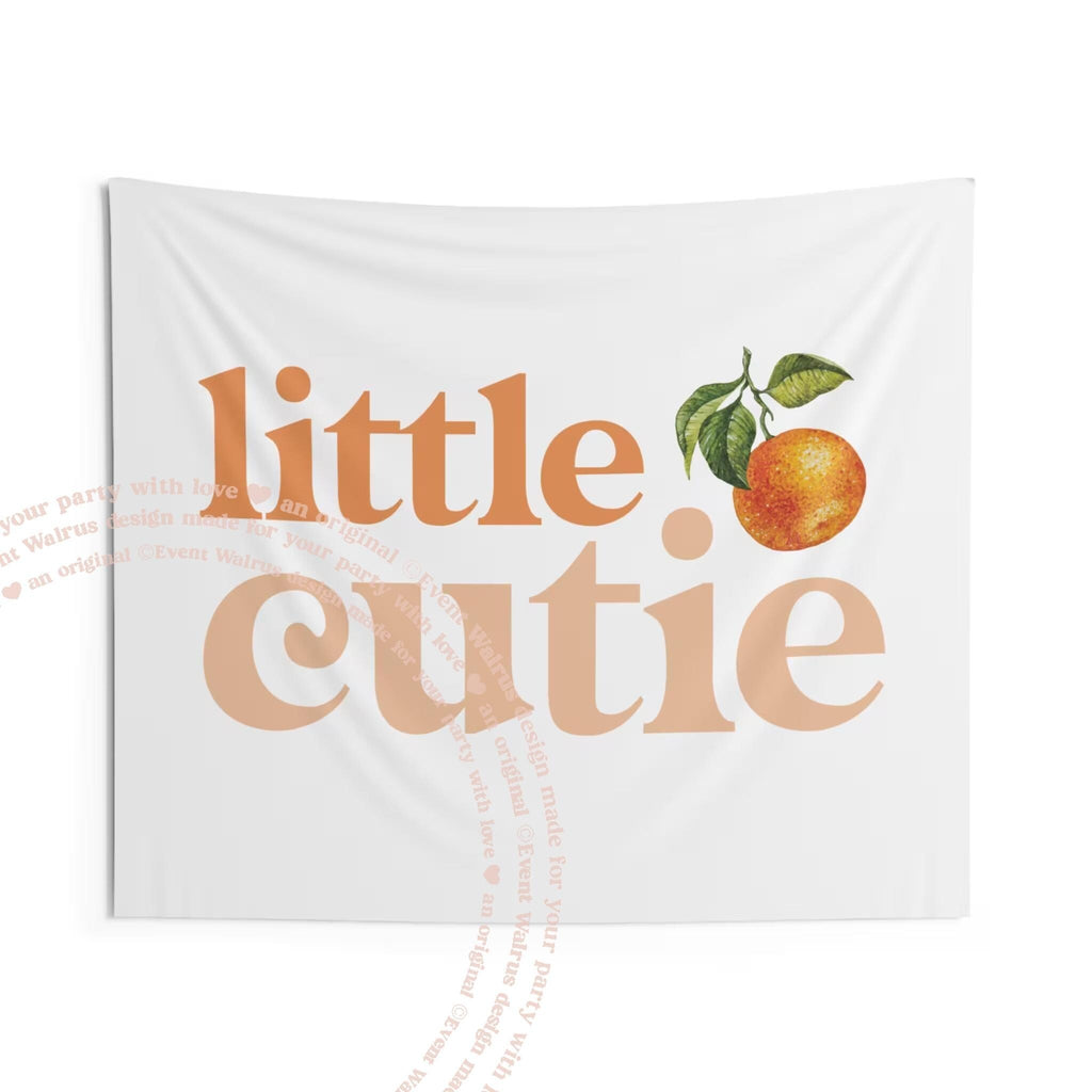The little cutie backdrop hanging flat, showing the orange lettering and watercolor clementine.