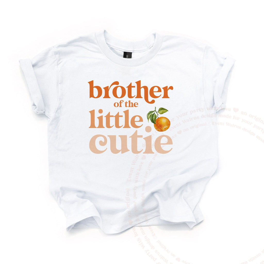 White kids Brother of the Little Cutie tee with a clementine, laid flat.