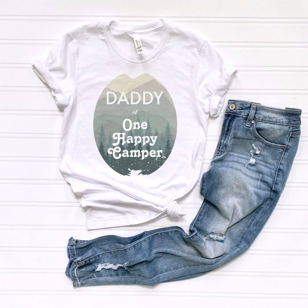 White Daddy of One Happy Camper tee laid flat beside jeans.