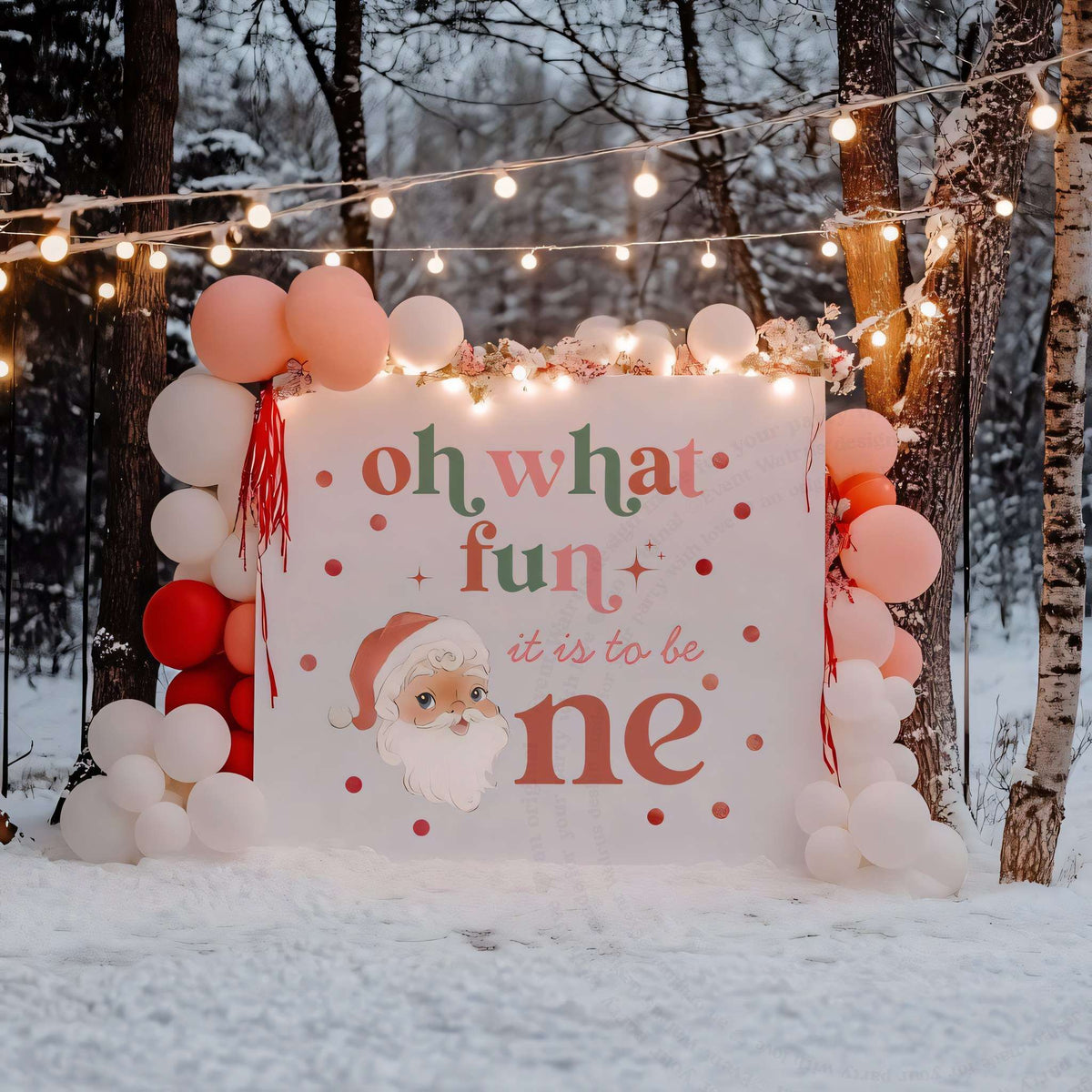 Oh what fun Christmas birthday backdrop between blush balloon columns under string lights in a winter forest.