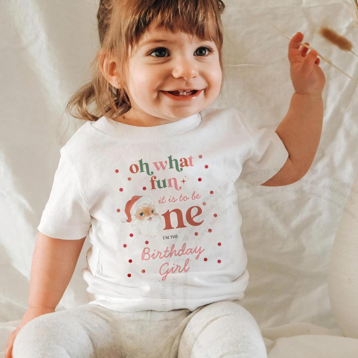 Laughing baby girl in a white Oh What Fun Birthday Girl baby tee.
