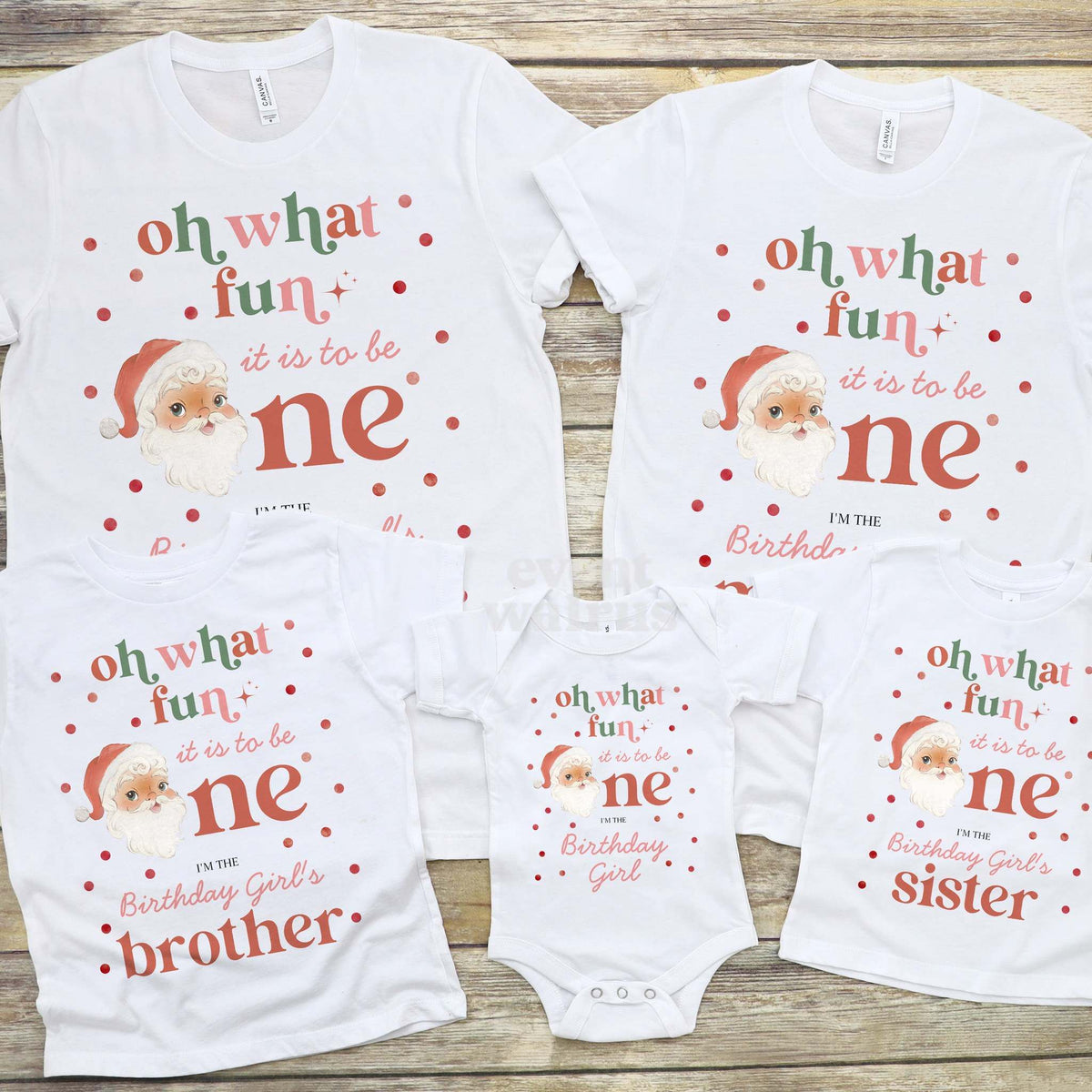 Retro Santa bodysuit laid out with the family's Oh What Fun shirts on wood.