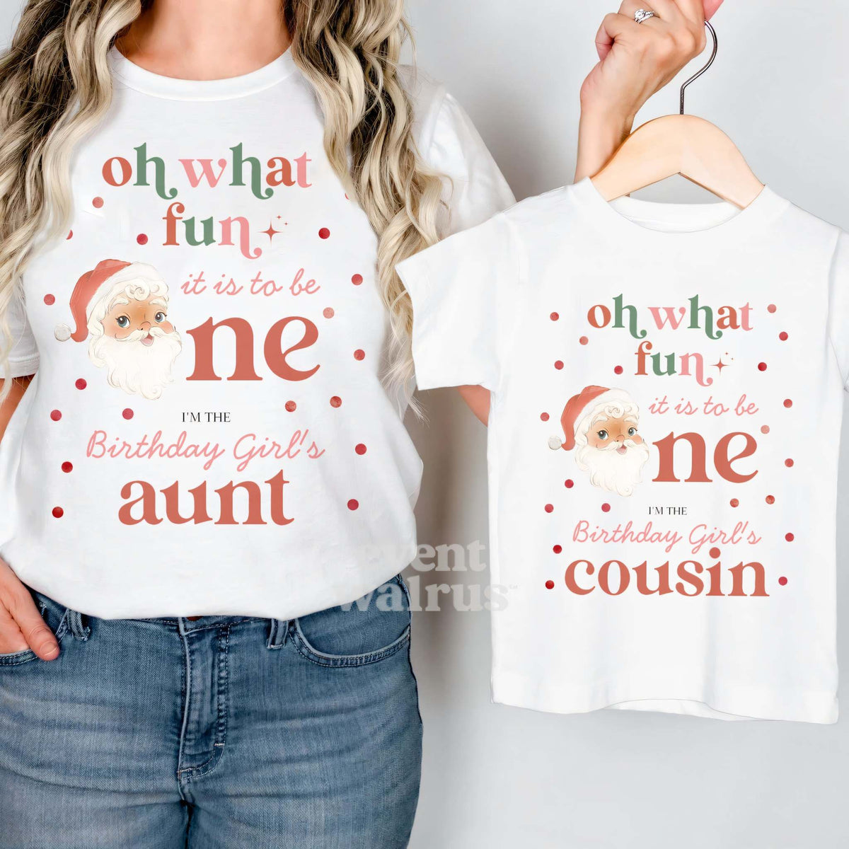 White Oh What Fun Cousin tee on a hanger held up by an aunt in her matching shirt.