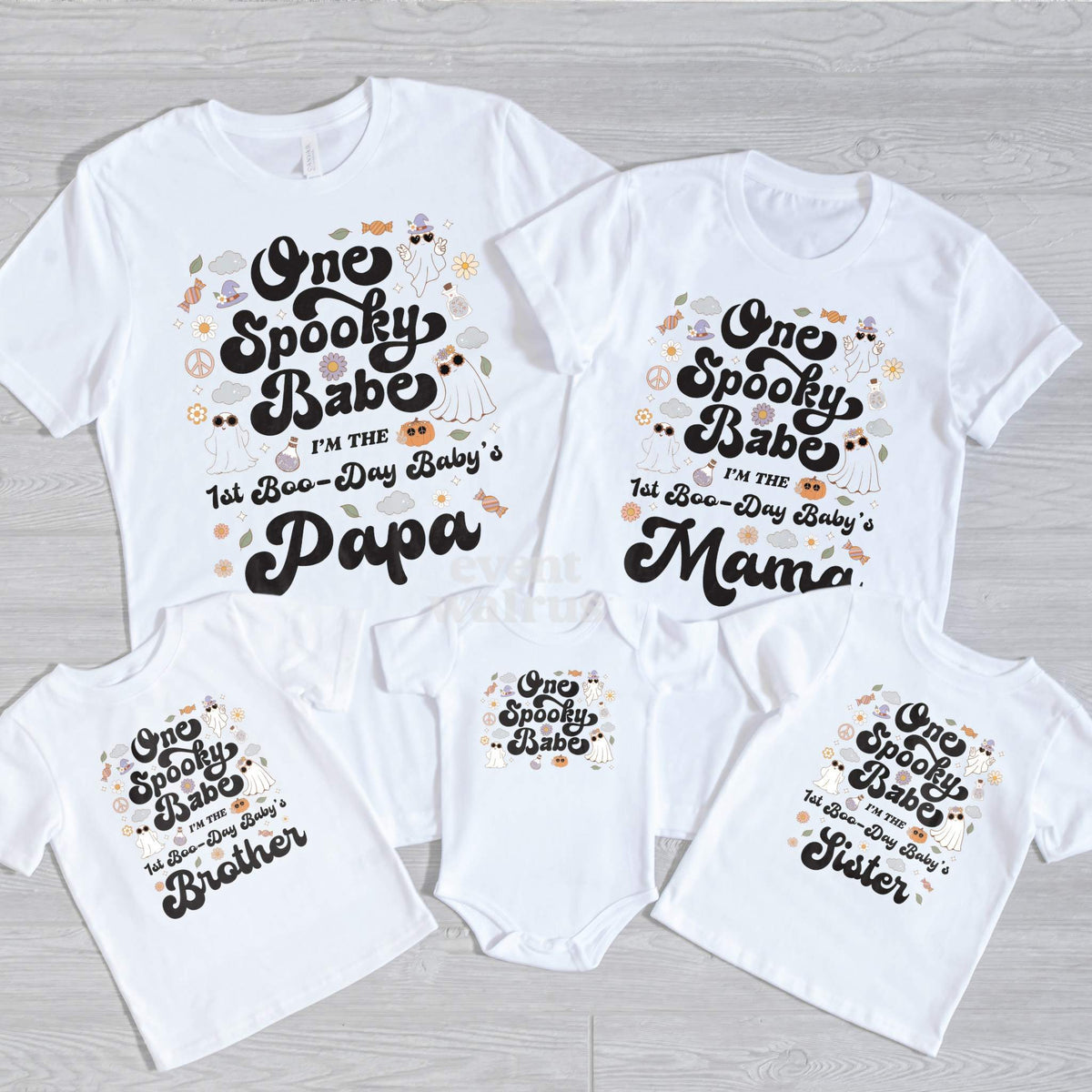 Papa, Mama, Brother, Sister and baby One Spooky Babe shirts on gray wood.