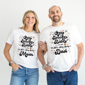 Mom and Dad standing together in white One Spooky Babe Mom and Dad shirts.