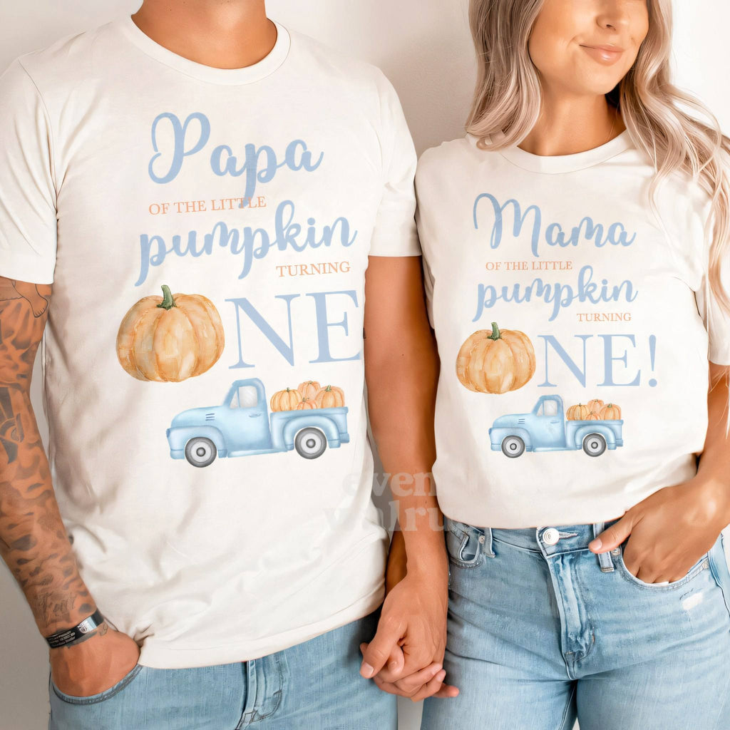 Dad and Mom holding hands in white Papa and Mama Little Pumpkin shirts.